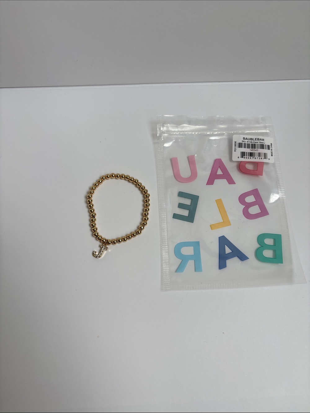 BaubleBar Gold Beaded Bracelet with Letter Charm